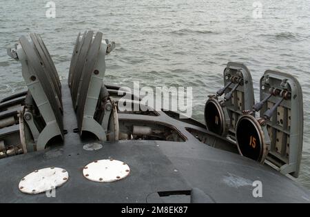 The hatches of the 12 vertical-launch Tomahawk missile tubes stand open on the bow of the nuclear-powered attack submarine USS OKLAHOMA CITY (SSN-723). Base: USS Oklahoma City (CG 5) State: Virginia (VA) Country: United States Of America (USA) Stock Photo