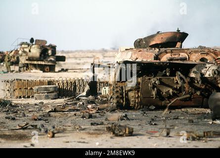 A demolished Iraqi BMP-1 mechanized infantry combat vehicle and other equipment in the Euphrates River Valley in the aftermath of Operation Desert Storm.. Subject Operation/Series: DESERT STORM Country: Iraq(IRQ) Stock Photo