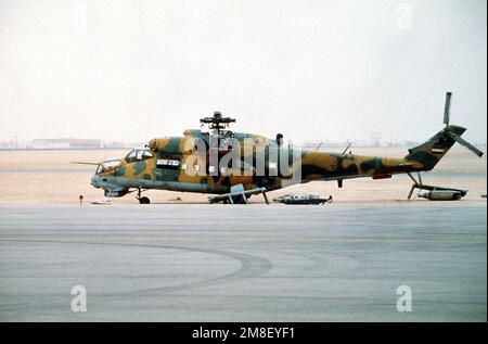 A captured Iraqi MIL Mi-24 Hind helicopter stands at an XVIII Airborne Corps airfield during Operation Desert Storm.. Subject Operation/Series: DESERT STORM Country: Saudi Arabia(SAU) Stock Photo