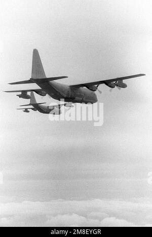 Two KC-130F Hercules aircraft from Marine Refueler-Transport Squadron 152 (VMGR-152) fly off the coast of Korea as they await the arrival of F/A-18 Hornet aircraft during refueling operations. Country: Unknown Stock Photo