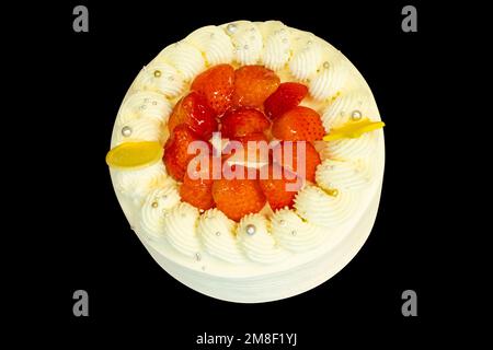 Die cut of vanilla Birthday cream cake on black isolated. Stock Photo