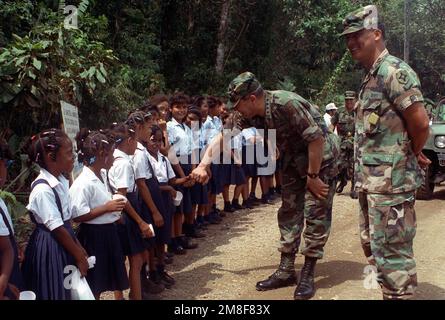 GEN Colin Powell, chairman, Joint Chiefs of STAFF, greets Panamanian school children at Nombre de Dios. Powell is visiting Panama during exercise Fuertes Caminos '91. Subject Operation/Series: FUERTES CAMINOS '91 Country: Panama(PAN) Stock Photo