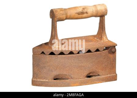 A vintage rusty carbons heated iron isolated on white. Stock Photo