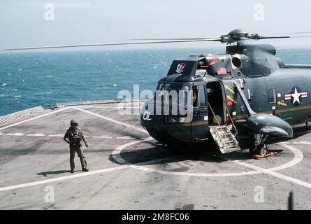 https://l450v.alamy.com/450v/2m8fc06/a-helicopter-crew-member-stands-near-the-sh-3-sea-king-helicopter-of-vice-adm-stanley-r-arthur-commander-seventh-fleet-arthur-is-visiting-the-blue-ridge-prior-to-its-arrival-in-port-at-yokosuka-japan-following-deployment-in-the-persian-gulf-area-during-operations-desert-shielddesert-storm-subject-operationseries-desert-shielddesert-storm-country-unknown-2m8fc06.jpg