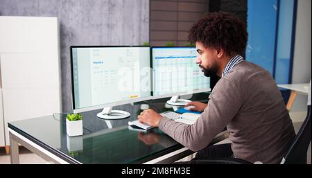 Spreadsheet Analyst Employee Worker. Medical Report On Computer Stock Photo