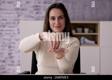 Adult Learning Sign Language For Deaf Disabled Stock Photo