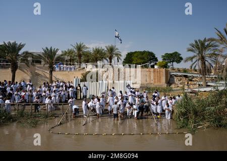 Qasr el Yahud, Israel - October 31 2022: Pilgrims being Baptised on the Site of the Baptism of Jesus Christ on the West Bank of the River Jordan. Stock Photo