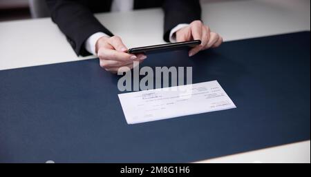 Remote Check Deposit Using Mobile Photo Scanning Stock Photo