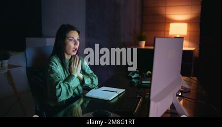 Frustrated Businesswoman Looking At Her Computer Screen In Dismay Stock Photo