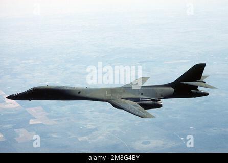 An Air-to-air Left Side View Of A B-1B Aircraft Banking Into A Right ...