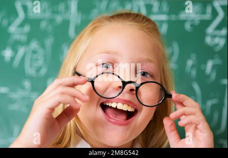 Im excited to learn. Portrait of a cute blonde girl looking excited in class. Stock Photo