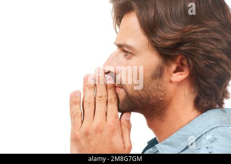 Thinking, doubt and mockup with a man in studio isolated on a white background being confused by an idea. Face, profile and praying with a handsome Stock Photo