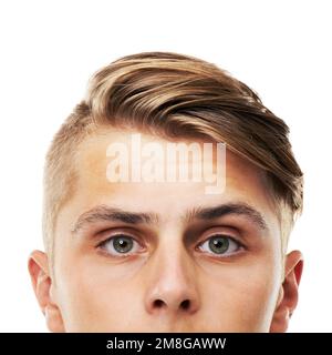 Looking over the edge. Cropped portrait of the upper half of a young mans face isolated on white. Stock Photo