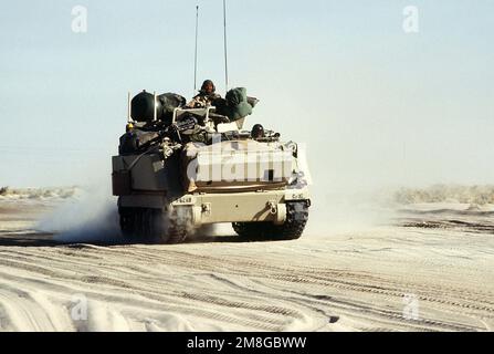 An M-163 Vulcan 20mm self-propelled anti-aircraft gun system travels with a convoy on a desert road during Operation Desert Shield. Subject Operation/Series: DESERT SHIELD Country: Saudi Arabia(SAU) Stock Photo