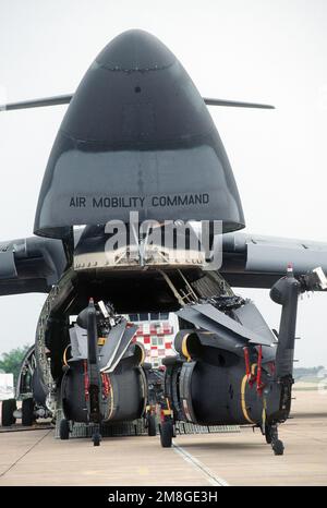 A pair of UH-60 Blackhawk helicopters from the 377th Medical Company are loaded aboard a C-5 Galaxy aircraft after being used during the joint Thai-U.S. training exercise Cobra Gold '92. Subject Operation/Series: COBRA GOLD '92 Base: Korat Royal Thai Air Force Base Country: Thailand (THA) Stock Photo