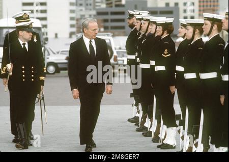 Secretary of the Navy H. Lawrence Garrett III reviews a Royal Australian Navy honor guard during ceremonies commemorating the 50th anniversary of the Battle of the Coral Sea. Base: Hobart State: Tasmania Country: Australia(AUS) Stock Photo