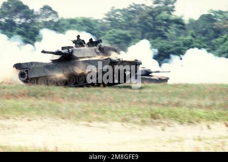 In a maneuver of speed and stability, with its 120mm main gun and special armor, a tank crew from the 2nd Tank Battalion, 2nd Marine Division demonstrates the M1A1 Abrams tank and its ability to close with and destroy the enemy on the integrated battlefield during Operation Ocean Venture 92. Subject Operation/Series: OCEAN VENTURE 92 Base: Marine Corps Base, Camp Lejeune State: North Carolina (NC) Country: United States Of America (USA) Stock Photo