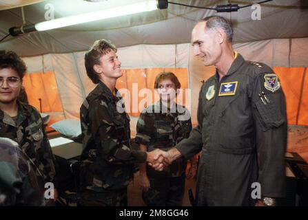 U.S. Air Force CHIEF of STAFF GEN. Merrill A. McPeak greets nurses at the 23rd Medical Group's air transportable hospital during the general's visit to Air Force personnel deployed during Operation Desert Shield.. Subject Operation/Series: DESERT SHIELD Country: Saudi Arabia(SAU) Stock Photo