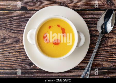 Strained lentil soup on a white porcelain plate Stock Photo