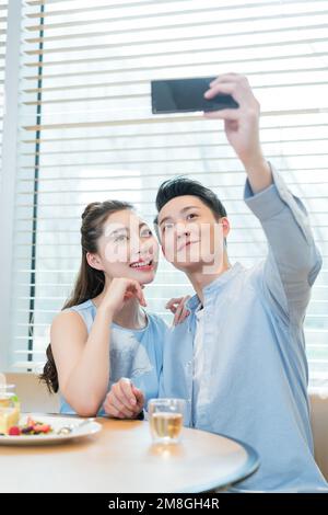 The afternoon tea time young lovers Stock Photo