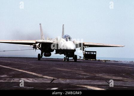 An F-14 Tomcat Aircraft Stops After Landing On The Flight Deck Of The 