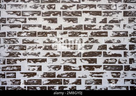 Background from a gray brick wall with cement residues Stock Photo