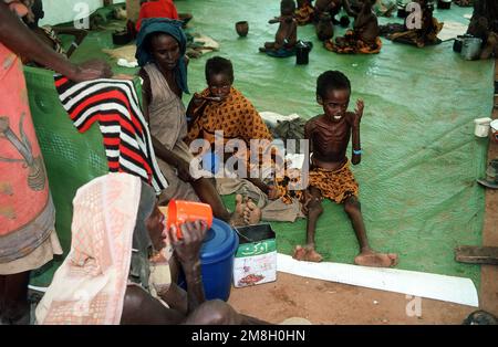 Somali refugees are fed at an aid station set up during Operation Restore Hope relief efforts. Subject Operation/Series: RESTORE HOPE Base: Bardera Country: Somalia (SOM)
