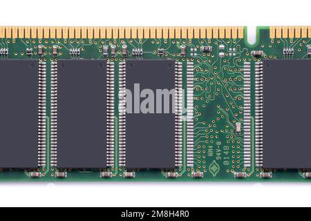 Electronic green circuit board with many electrical components, isolated on white background. Option for text or design on vertical gray component Stock Photo