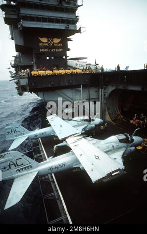 Two Attack Squadron 75 (VA-75) A-6E Intruder aircraft are secured on an elevator of the aircraft carrier USS JOHN F. KENNEDY (CV-67). Country: Adriatic Sea Stock Photo