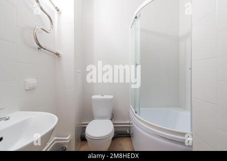 Photo of a bathroom in pastel colors with the lights on Stock Photo