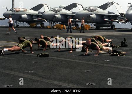 Members of the Special Purpose Marine Air Ground Task Force (SPMAGTF) participate in physical training on the flight deck of the nuclear-powered aircraft carrier USS THEODORE ROOSEVELT (CVN-71) during Operation Deny Flight. Subject Operation/Series: DENY FLIGHT Country: Adriatic Sea Stock Photo