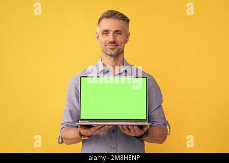 smiling businessman presenting product. presentation on computer. office manager Stock Photo