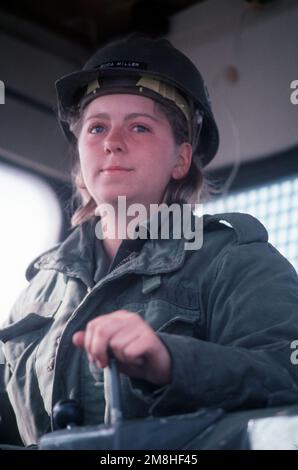 Equipment Operator Construction Apprentice Miller climbs operates a bulldozer during a causeway-building exercise with Amphibious Construction Battalion 1 (ACB-1). Base: Naval Amphibious Base, Coronado State: California (CA) Country: United States Of America (USA) Stock Photo