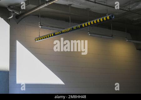 Height check bar for vehicles maximum height notice to enter the garage Stock Photo