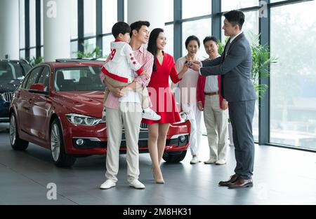 A family of choose and buy car Stock Photo