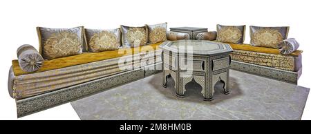 Large moroccan couch with cushions and ornated table isolated on white with clipping path Stock Photo