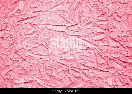 Abstract drawing on plastered wall. Toned Viva Magenta, background, texture. Copy space. Selective focus. Stock Photo