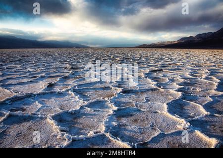 The crusted pans of Badwater Basin sit at 282 feet below sea level in Death Valley National Park, California. Stock Photo
