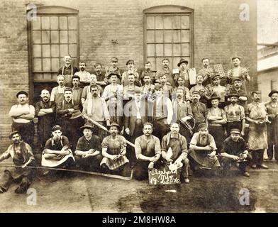 Old-Fashioned Workers at Manufacturing Plant holding Products, Hardware, Tools, Eberhard Manufacturing Company, 1900, Turn of the Century Factory Workers, Photo Stock Photo
