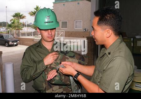 Acb Inls Seabees assigned to Amphibious Construction Battalion One (ACB-1) raise ...
