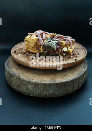 Brioche Truffle Ham Cheese Pumpkin Bread, mixed with Cheese Cake Christmas Protein Bar and mixed nuts sprinkle on the wooden tray. The concept of Heal Stock Photo