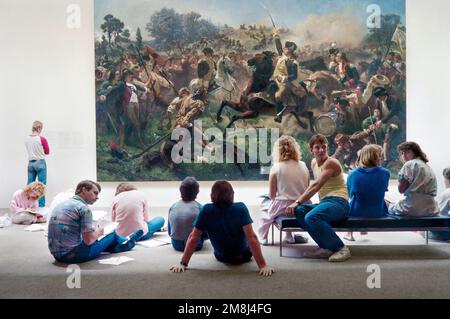 University of California, Berkeley students studying the 1853 painting of Washington Rallying the Troops at Monmouth by Emanuel Leutze. It has been st Stock Photo