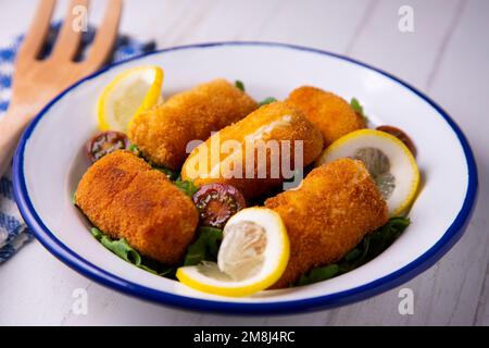 Fish croquette. The croquette is a portion of dough made from a dense sauce such as bechamel and a mincemeat of various ingredients or vegetables. Stock Photo