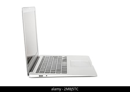 Side view of gray laptop with blank screen on white background Stock Photo