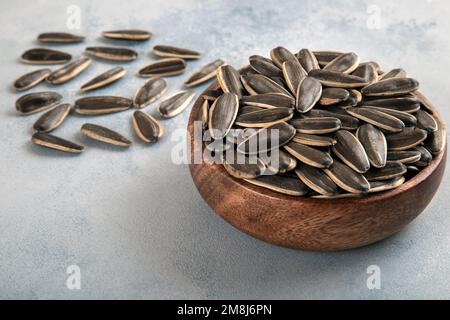 Black sunflower seeds in a bowl,closeup Stock Photo