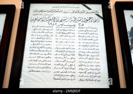 Cairo, Egypt, January 7 2023: A list with names of Egyptian police martyrs who sacrificed themselves against British invaders in 1952 written in Arabi Stock Photo