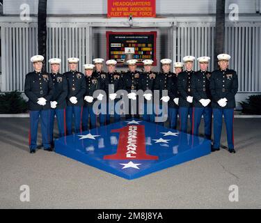 Exterior, MLS, MG Charles E. Wilhelm, USMC, Commanding General 1ST Marine  Division and 12 Regimental Commanders, in dress blues, line up on two sides  of a large replica of the 1ST Marine