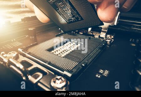 Computer Technician Installing New Powerful Processor While Building New Workstation. Close Up Photo. Stock Photo