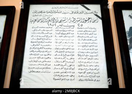 Cairo, Egypt, January 7 2023: A list with names of Egyptian police martyrs who sacrificed themselves against British invaders in 1952 written in Arabi Stock Photo