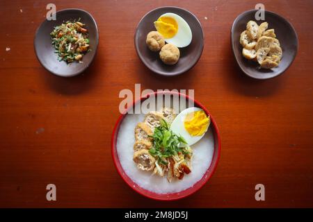 congee porridge with chicken slice, tofu, egg. congee porridge from hong kong. chinese food Stock Photo